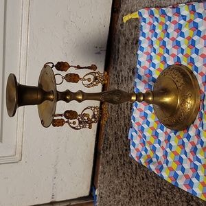 Solid brass candle holder with ornate droplets